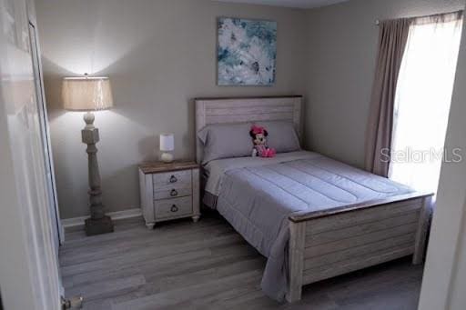 bedroom with light wood-type flooring