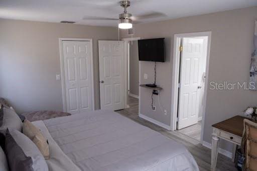 bedroom featuring ceiling fan and a closet