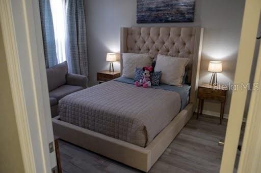 bedroom featuring wood-type flooring