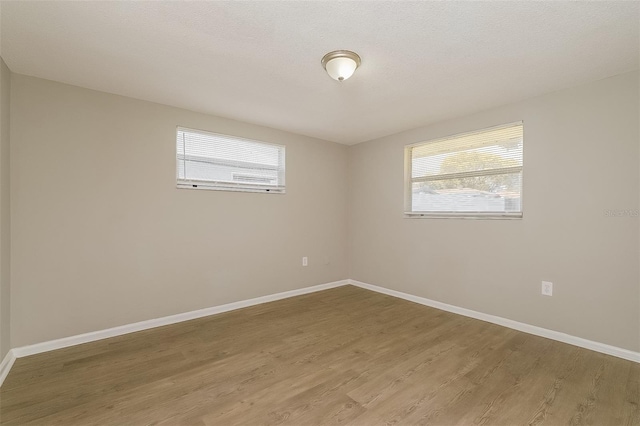 spare room featuring hardwood / wood-style floors