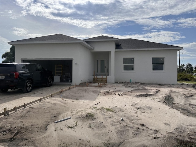 view of front of property with a garage