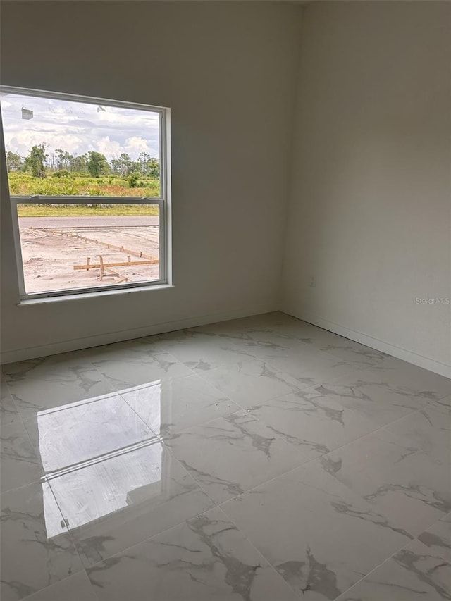 unfurnished room with a wealth of natural light