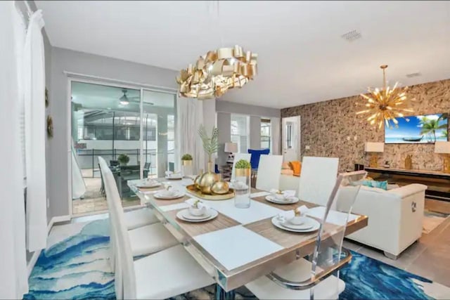 tiled dining space featuring a notable chandelier