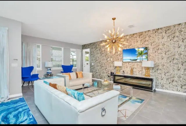 tiled living room featuring a chandelier