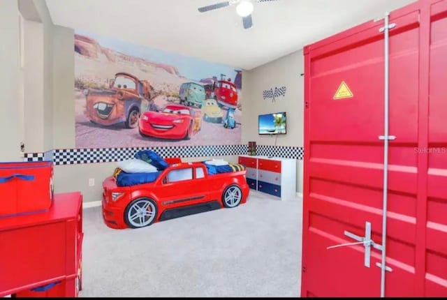 carpeted bedroom with ceiling fan