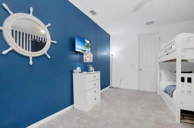 carpeted bedroom with ceiling fan