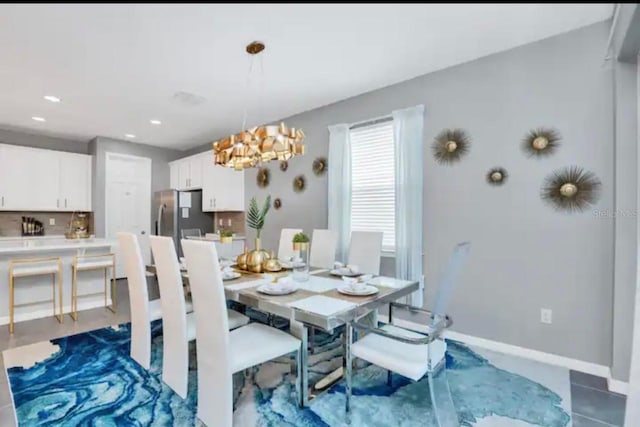 dining area featuring a chandelier