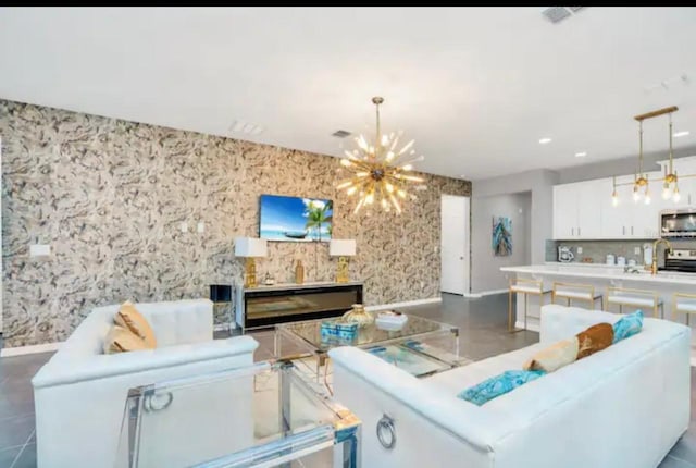 living room featuring an inviting chandelier