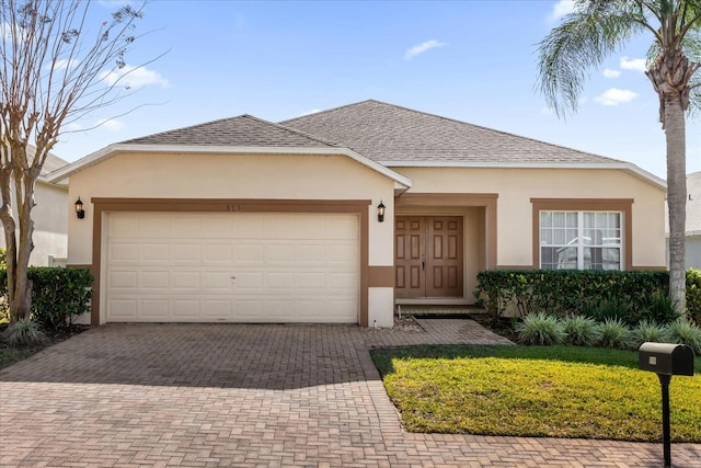 view of front of property with a garage