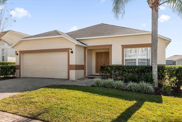 ranch-style house with a front yard and a garage