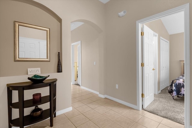 corridor featuring light tile patterned floors