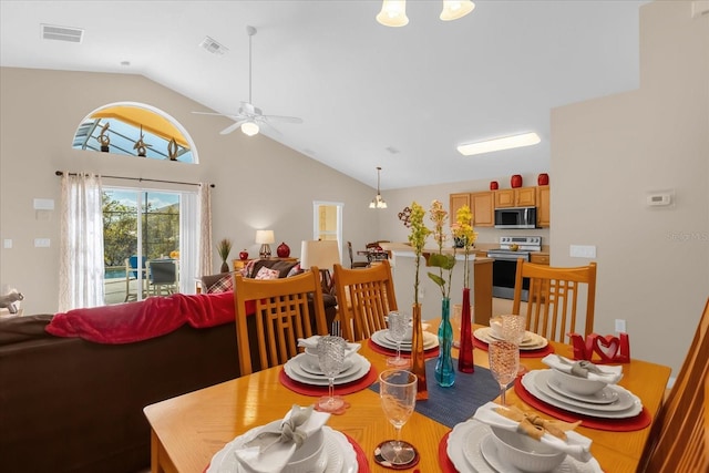 dining area with vaulted ceiling and ceiling fan