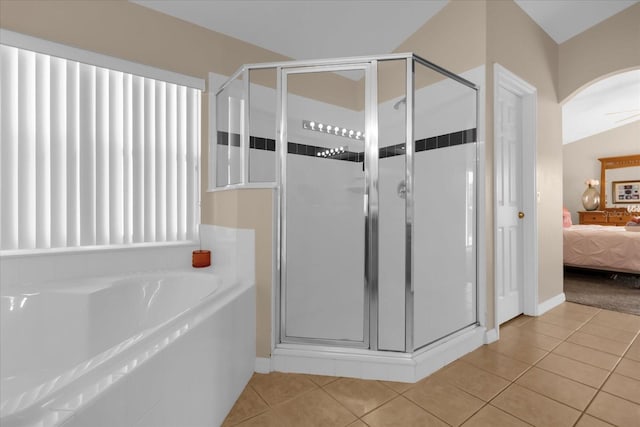 bathroom with tile patterned floors, ceiling fan, independent shower and bath, and vaulted ceiling