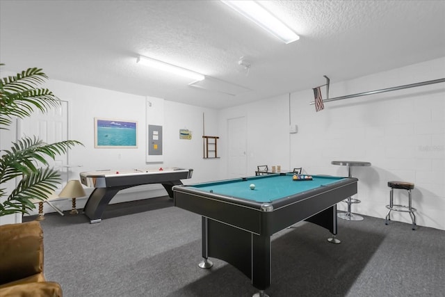 recreation room with carpet, a textured ceiling, electric panel, and pool table