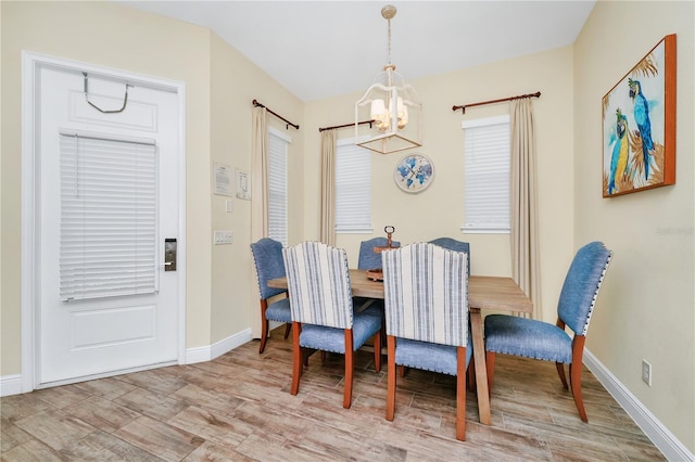 dining space with a notable chandelier