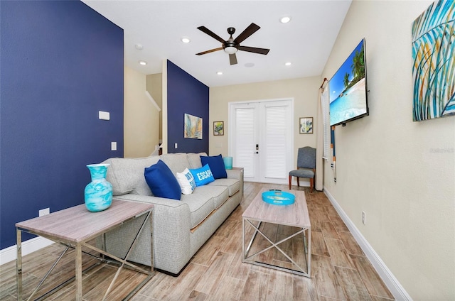 living room with ceiling fan and french doors