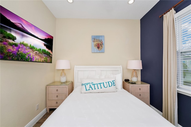 bedroom featuring dark hardwood / wood-style flooring