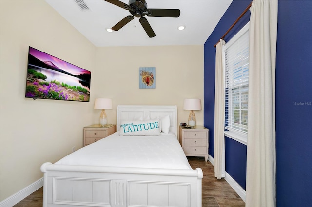 bedroom featuring ceiling fan and dark hardwood / wood-style flooring