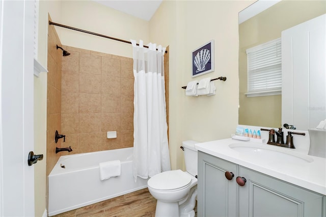 full bathroom featuring vanity, toilet, hardwood / wood-style floors, and shower / bath combo