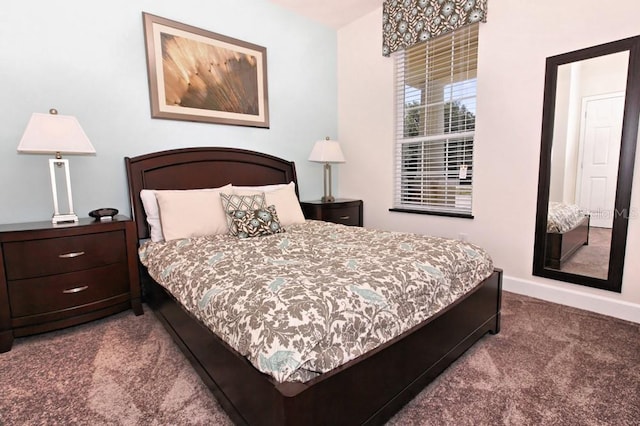 carpeted bedroom featuring baseboards