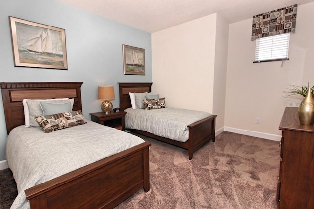 carpeted bedroom with baseboards