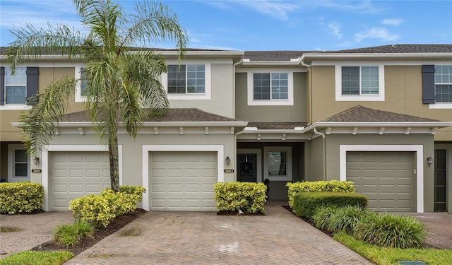 townhome / multi-family property featuring a garage