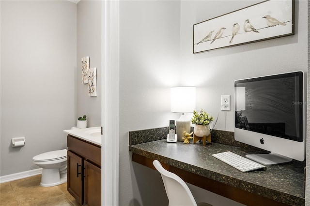 bathroom featuring tile patterned flooring, vanity, and toilet