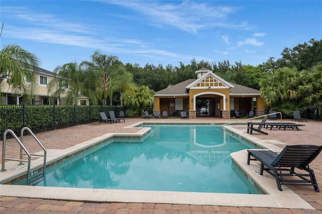 view of swimming pool with a patio