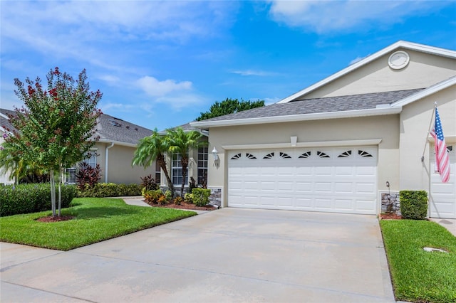 ranch-style house featuring a garage and a front yard