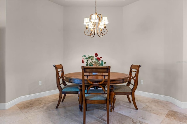 dining room featuring a chandelier and light tile patterned floors