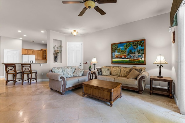 tiled living room featuring ceiling fan