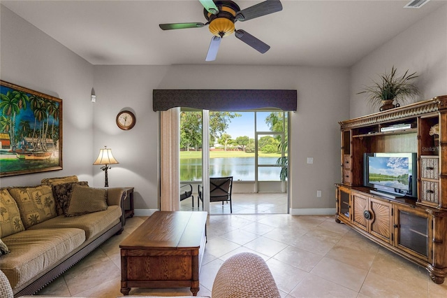 tiled living room featuring ceiling fan