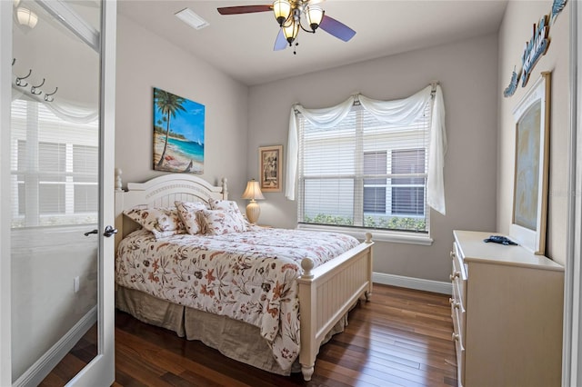 bedroom featuring ceiling fan and dark hardwood / wood-style flooring