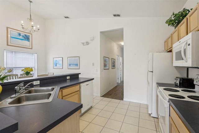 kitchen featuring light tile patterned flooring, white appliances, light brown cabinetry, and sink