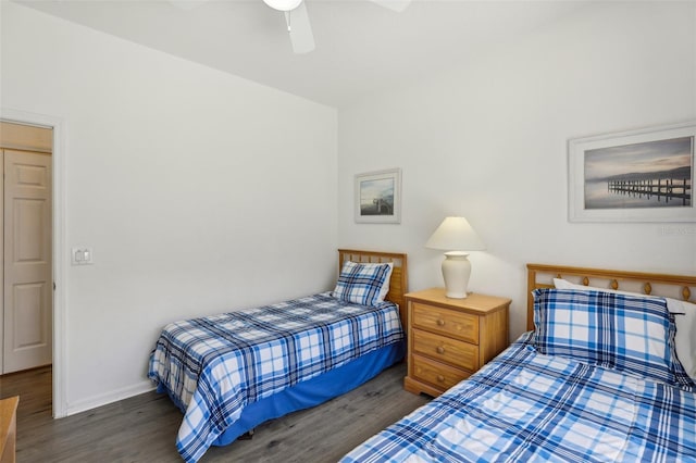 bedroom featuring ceiling fan and dark hardwood / wood-style flooring