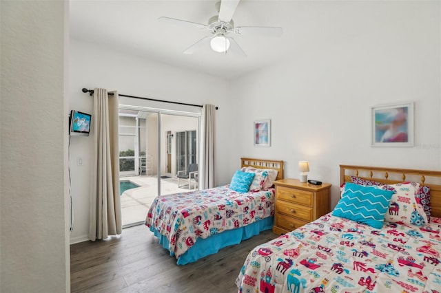 bedroom featuring access to exterior, dark hardwood / wood-style floors, and ceiling fan