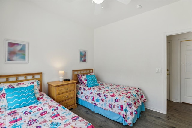 bedroom with ceiling fan and dark hardwood / wood-style flooring