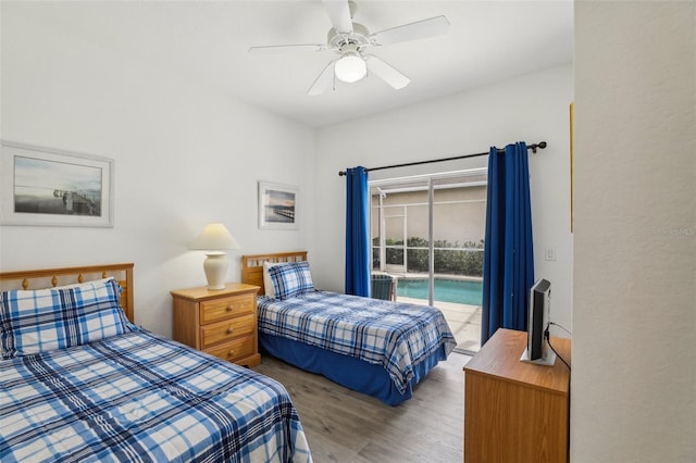 bedroom featuring ceiling fan, wood finished floors, and access to exterior