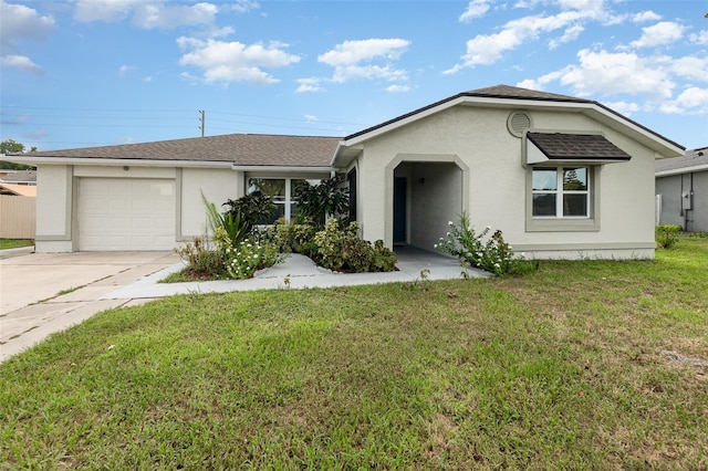 ranch-style house featuring a garage and a front yard