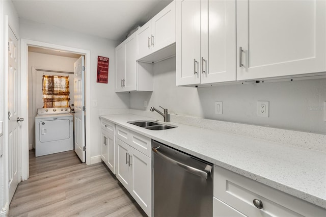 kitchen featuring white cabinetry, stainless steel dishwasher, washer / clothes dryer, and sink