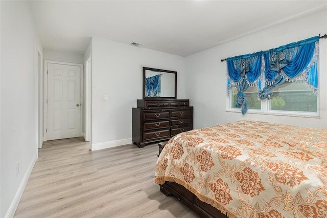 bedroom with light hardwood / wood-style floors