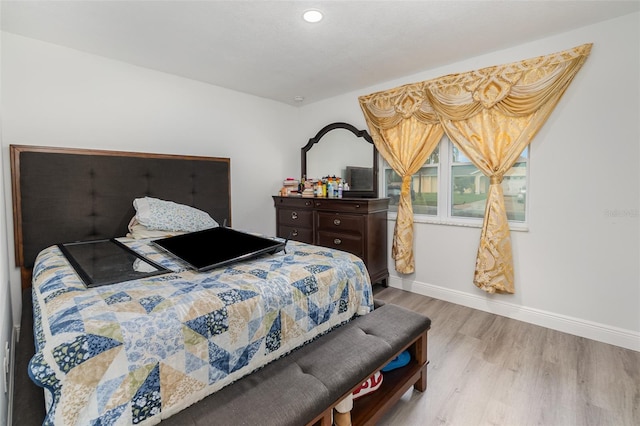 bedroom with light hardwood / wood-style flooring