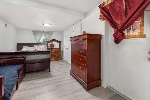 bedroom with light hardwood / wood-style floors