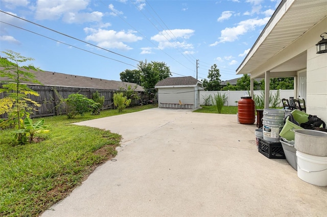 view of patio featuring a storage unit