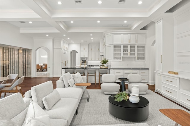 living room with beam ceiling, hardwood / wood-style floors, and coffered ceiling