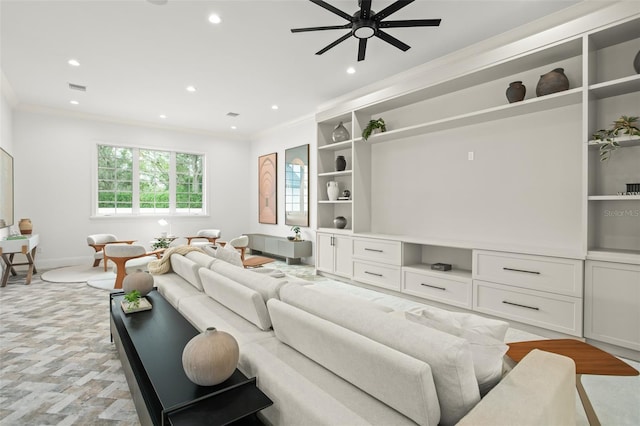 living room with ceiling fan and crown molding