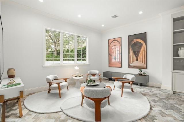 living area with crown molding