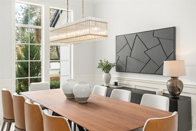 dining space featuring a notable chandelier