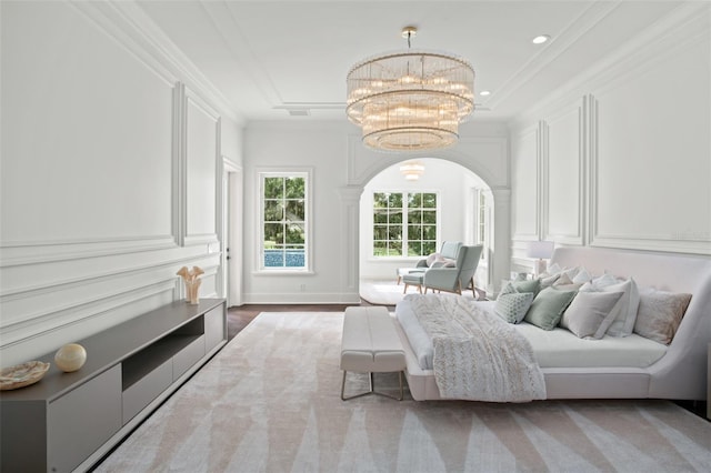 bedroom with ornamental molding and a notable chandelier