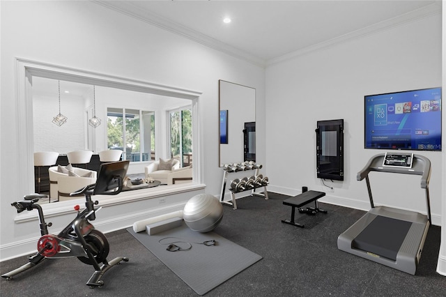 workout room with a chandelier and crown molding